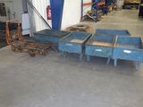 a large warehouse with a lot of blue boxes on the floor