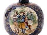 a blue vase with a picture of a group of people on it
