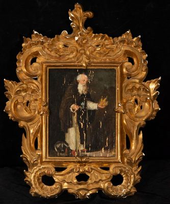painting of an old man in a gold frame with a black background