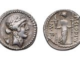 a silver coin with an image of a woman and a man on it