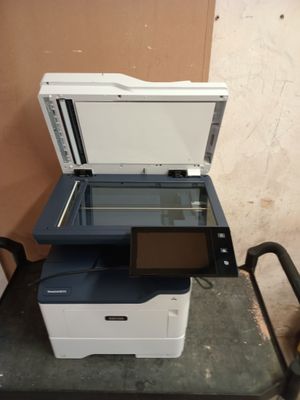 a printer that is sitting on top of a cart
