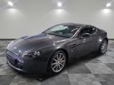 an image of a grey aston car in a showroom