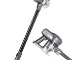 a close up of a vacuum and a stick on a white background