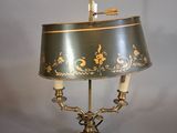 a lamp that is sitting on a table with a lamp shade on it