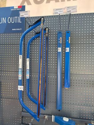 many different tools hanging on the wall in the store