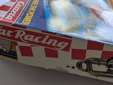 a box with a toy car on it sitting on a table