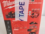 the box is open on the table with the tools in it