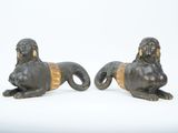 pair of bronze lions on a white background
