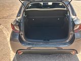 the back of a car with its trunk open on the side of the road