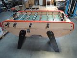 a foosball table in the middle of a warehouse