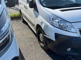 a white van that is parked in a parking lot
