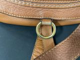 an image of a close up of a brown bag with a metal ring