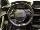 the interior of a car with a steering wheel and dashboard controls