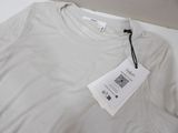 a white t - shirt with a tag attached to it