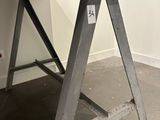 a table with a sign on it in a room