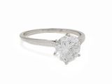a close up of a diamond ring on a white background