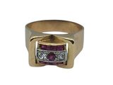 a close up of a gold ring with a pink stone