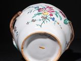 an image of a white vase with a floral design on it