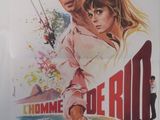 l'affiche du film « Home of the Rio », mettant en scène une femme et un homme