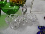 many different colored glass items on the table