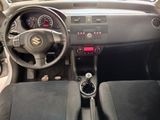 the interior of a car with a steering wheel and dashboard controls