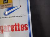 a box of cigarettes sitting on a table next to a box of cigarettes