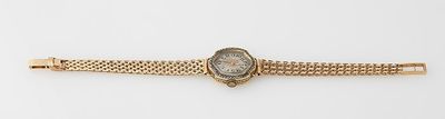 an image of a gold bracelet with a stone in the center