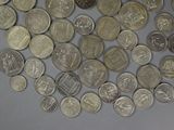 a lot of coins that are on the table
