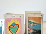 three cards on a table with a picture of a heart and a picture of monaco