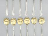 a set of twelve silver and gold plated spoons