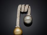a pair of pearl and diamond earrings