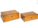 two wooden boxes sitting next to each other on a white surface