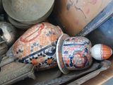 a box full of vases and other items on a table