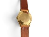 an image of a close up of a wrist watch on a white surface