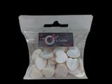 a bag of white buttons in it on a black background