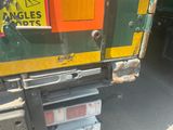 a close up of the back end of a truck with stickers on it