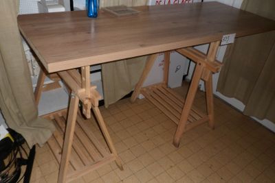 a wooden table with a blue vase on it