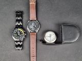 two watches sitting next to each other on a table