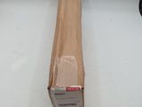 a box with a piece of wood on the floor