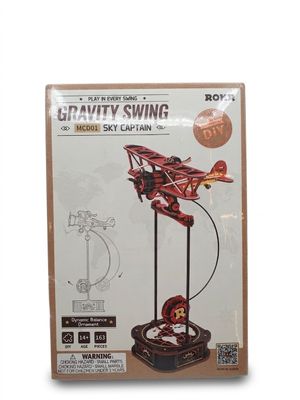 une photo d'une maquette d'avion rouge posée sur un socle