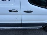 a white van that has a sticker on the side of it