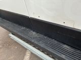 a close up view of a black and white bus