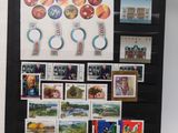 a picture of a refrigerator with stamps and magnets on it