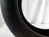 a close up of a tire on a white surface with a white background