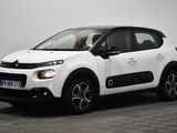 a white citrole is parked in a room with a checkered floor