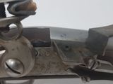 a close up of a gun that is on a table