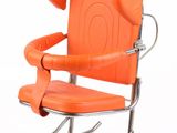 an orange leather chair with a metal frame and arm rests against a white background