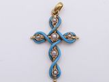 a close up of a cross made of gold and blue glass beads