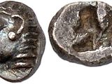 a silver coin with an image of a man on it