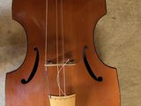 a violin hanging on the wall next to a wall